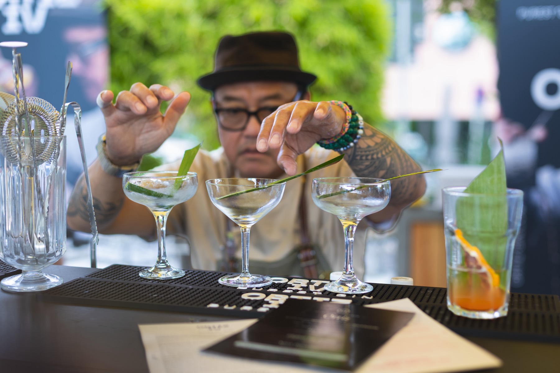 Bartender straining cocktails