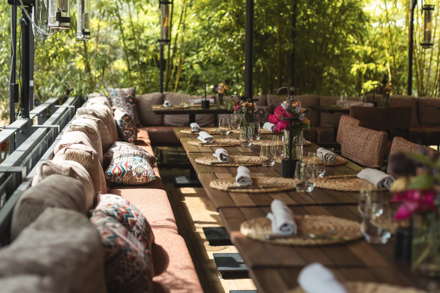 NEO Heidelberg — lounge table set on the leafy terrace